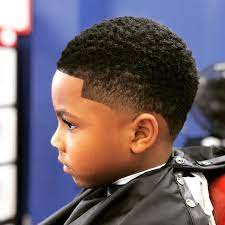 With its clean sides and back, it leaves plenty of room to play around. Image May Contain 1 Person Boys Fade Haircut Boys Haircuts Little Black Boy Haircuts