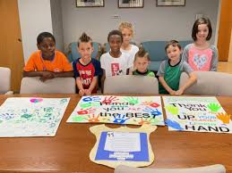 Sunview students, parents deliver posters of thanks to Lyndhurst officials  after Sept. 13 storm