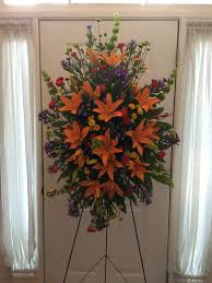 Orange Lilies In A Standing Spray Funeral Flower Arrangements Funeral Flowers Funeral Sprays