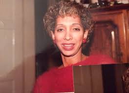 A Photograph of Marlow Monique Dickson Wearing a Red Sweater