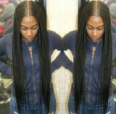 She chose a middle part for a style that is casual. Middle Part Cornrows Kids Braided Hairstyles Natural Hair Styles For Black Women Black Girl Braids