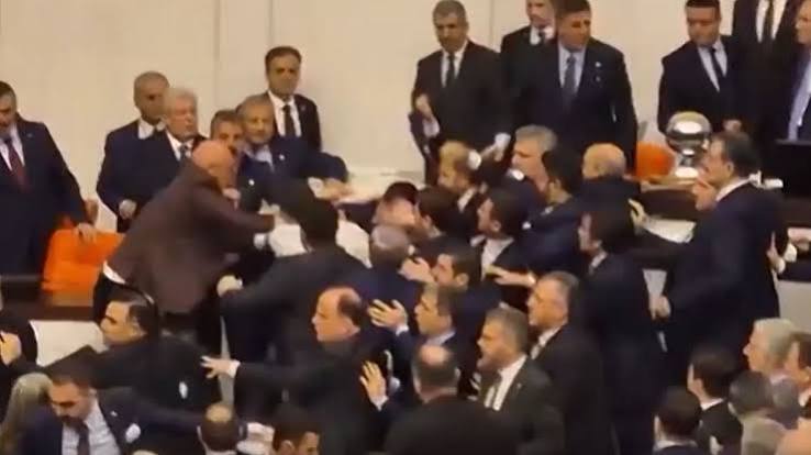 Wild moment mass brawl breaks out in Turkish parliament as politicians throw punches over controversial appointment