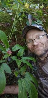 4 yr old grandson digging ginseng in the Appalacian hills.
