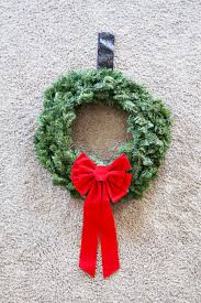 It is so fun and inexpensive to diy your own wreaths. How To Hang Christmas Wreaths On Exterior Windows Abby Lawson
