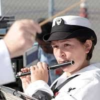 Navy Diver 1st Class David Sweeten, assigned to the rescue and salvage ship  USS Salvor (ARS 52) assists Philippine Navy diver Seaman 2nd Class Melodina  Besana.