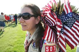 Scouts and others placed flags at gravesites for the Memorial Day weekend 