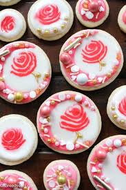 You can cover them with fondant, rainbow sprinkles, delicious melted chocolate… i could go on, but one of my favorite ways is to flood a cookie with royal icing (flood icing). Rose Cookies Decorated On A Sugar Cookie Recipe With Royal Icing