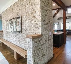 Stem walls, grade beams basement walls. Interior Brick Wall On Foyer 1 2 Brick Tiles Were Used To Add Authentic Rustic Charm To This Home Brick Brick Interior Wall Brick Tile Wall Faux Brick Walls