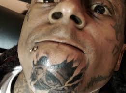 The newest addition is on his right cheek, just above his peace sign tattoo. Here A A Close Up Of The One On His Chin 55 Hip Hop Tattoos That Will Capital Xtra
