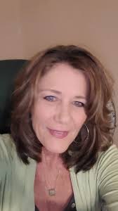 New hairstyle for a 58-year-old woman after cutting off long hair