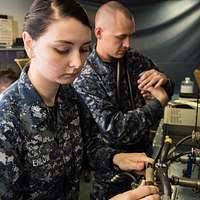 Interior Communications Electrician 3rd Class Suzanne Drew mans-the-rails  of the Blue Ridge-class command ship USS Mount Whitney (LCC 20) as the ship  arrives in its forward-deployed port of Gaeta, Italy