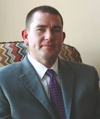 County board debates coroner's salary