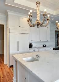 Herringbone Backsplash Transitional Kitchen Pink Peonies White Marble Kitchen White Cabinetry Refrigerator Panels