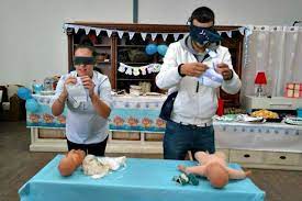 Photo Of Two People Playing In Baby Shorts Bb Baby People Photo Playing Shorts Baby Shower Funny Funny Baby Shower Games Baby Shower Juegos