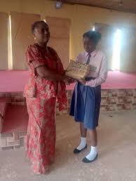 Award presentation to the overall best student in 2023 NECO BECE: BEULAH  DAVID RACHA (6As): English language, Business studies, CRK, Basic Science &  technology and Prevocational Studies.