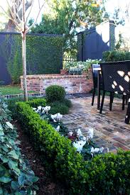 Traditional European Style Home With English Garden Fountain Water Feature With Seashell Fountain Front Yard Landscaping Design Garden Seating Yard Fountain