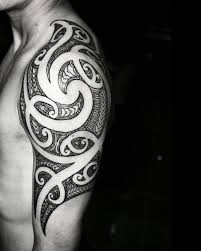 Tribal covered up with flower tattoo on upper back on a women. Stunning Tribal Tattoos That Will Make You Book An Appointment Tattoos Beautiful