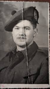 A Canadian soldier with what looks to be like the The Lorne Scots in Rome,  Italy.