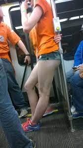 Nice legs of a female passenger riding on a train candid picture