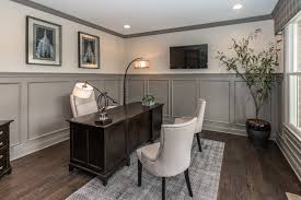 Gray Wainscoting In This Home Office Makes Your Space Feel Dignified And Professional Seen In The Wheatland At Thorpe Creek Located Home New Homes Home Office
