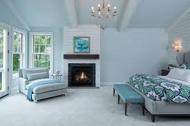 A navy blue color scheme will complement both the dark wood furniture and the light gray walls. Blue And Gray Master Bedroom With Shiplap Fireplace Wall Transitional Bedroom