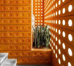 Check spelling or type a new query. The Brick Walls Alternate Between Circular Patterns And Tiny Windows On This New Building
