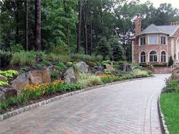 Blue/black slate paving, formal topiary add to the linear clean low maintenance entrance and driveway in london. Top 60 Best Driveway Landscaping Ideas Home Exterior Designs