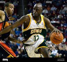 Seattle SuperSonics' Damien Wilkins (12) drives past Golden State Warriors'  Monta Ellis in NBA basketball action during the fourth quarter Sunday, Dec.  10, 2006 in Seattle. Wilkins scored 22 points in the