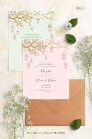 Modern Style Wedding Invitation Concept With Lanterns Hanging From A Tree In 2020 Indian Wedding Invitation Cards Wedding Card Design Indian Wedding Invitation Design