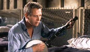 Cool Hand Luke(1967) Newman insisted on learning to play the banjo for the  "Plastic Jesus" scene. On the last take, He got frustrated after making an  error, which made him increase the