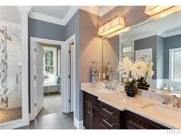 Black Bathroom Cabinets With White Countertops Unique Lighting It Master Bathroom Double Sinks With Cream Granite Countertop Over Dark Cabinets A Blue Bathroom Decor Restroom Decor White Bathroom Cabinets