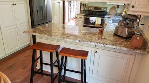 Pairing contemporary and industrial appeal, this design lends style with its bucket seat and clean lines. Additional Guest Seating Added To The Countertop Area Overhang Added Furniture Panels Minic The Cabinet Doors Where Cabinet Kitchen Design Kitchen Countertops