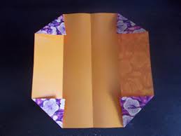Fold the left and right corners in to meet the center crease. How To Fold An Origami Business Card Holder