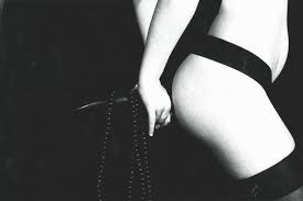 Strip (v.) and tease (v.) both were used in this sense in late 1920s. Horvat Frank Strip Tease Mutualart