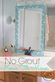 The tile frame around the mirror is very clean and unique for a bathroom, and i'm excited to follow your step by step instructions to recreate it in my own bathroom. No Grout Mosaic Tile Mirror The Diy Village