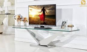 The design of this cabinet is simple, but looks significant with a clean look to it and has open shelves for multiple accessories and decorative exhibits. China Living Room Furniture Simple Glass Tv Stand Series Tv Unit Tv Cabinet Modern T01 China Tv Unit Tv Stand
