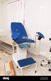 gyn gynecology gynecologist chair medical cabinet hospital examination  woman Stock Photo - Alamy