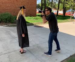 Check out our CPHS models! Health Sciences senior Taylor Weetman and P4  Chintan Barot take part in a marketing photo shoot to highlight  commencement week at our College. · Drake University College