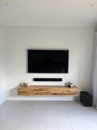 While a floating corner shelf is a lot sturdier than they look, due to their lack of visible supports, it would still be unsafe to place a large tv on a shelf, as the purpose of using a wooden ridge as a bracket, rather than shelf arms, is the shelf arms will not be able to get close enough to the corner of the wall. Collie Floating Tv Unit Ingrain