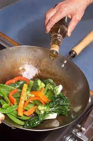 How To Use A Wok For Stir Frying Steaming Foodal Wok Recipes Wok Cooking Cooking