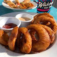 The duke burger had a free formed patty with bacon, onion rings and melted cheese. Our Maui Onion Rings Are Crispy Wahoo S Fish Taco Facebook