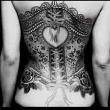 The rose is decidedly unisex in the tattoo world, but lace, with its intricate details and delicate construction, is generally seen as a feminine design. Unique Black Ink Lace Corset With Roses Tattoo On Back