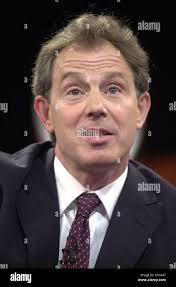 U.S. President George W. Bush and fellow G8 leaders stand behind England's  Prime Minister Tony Blair