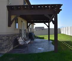 Wood pergolas this natural wood pergola is attached to the house offering style and shade to why our pergolas. Easy 12 X 24 11 Diy Attached Pergola Kit W Fullwrap Roof Western Timber Frame