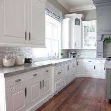 There are a few ways that you can coordinate your countertops and beige, tan and gray are three colors that are often used because they are neutral, which gives you more reign to be free techniques for combining kitchen countertops and cabinets. Grey Kitchen Cabinets White Countertops Design Ideas