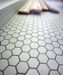We chose a large hexagon tile with very light gray grout for our kids' bathroom floor. The Perfect Grout Color Laundry Room Flooring Grout Color Room Flooring