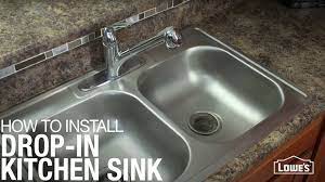 Feed the faucet's supply tubing and tailpiece through the gasket that seals the faucet to the sink and then up through the hole (or holes) in sink. How To Install A Drop In Kitchen Sink Lowe S