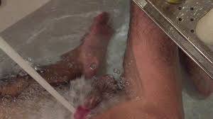 This lady uses water pressure from the jet stream to get an orgasm in the pool