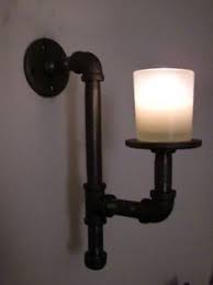 Black wall sconce light with candlestick. 18 Candle Wall Sconces Ideas Candle Wall Sconces Wall Sconces Sconces