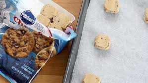 If baking frozen dough, add 2 minutes to the bake time. Pillsbury Chocolate Chip Cookie Dough Baking Instructions